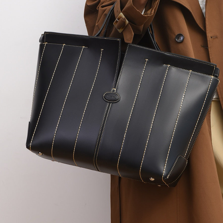 A timeless leather tote for the modern working woman on the go