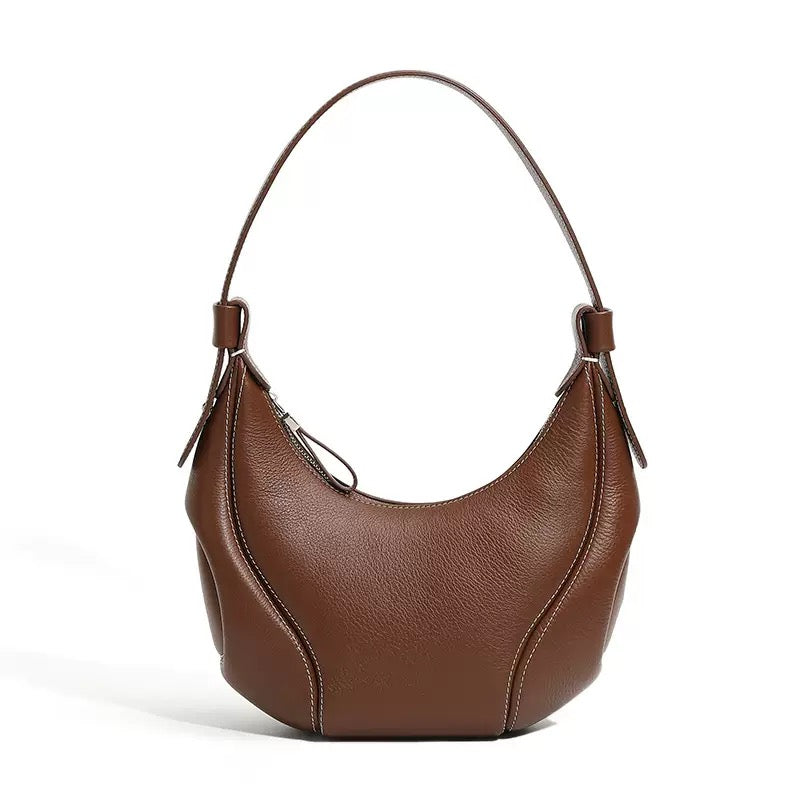Comfortable and Chic Handbag with Rolled Top Handles and Adjustable Strap