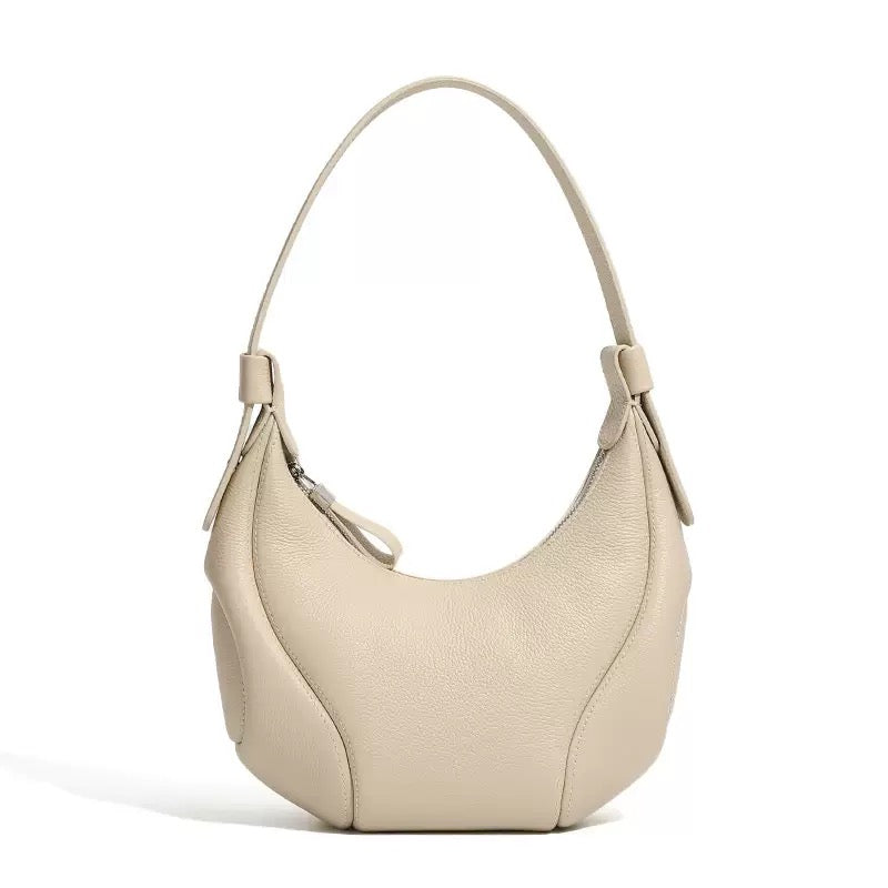 Comfortable and Chic Handbag with Rolled Top Handles and Adjustable Strap