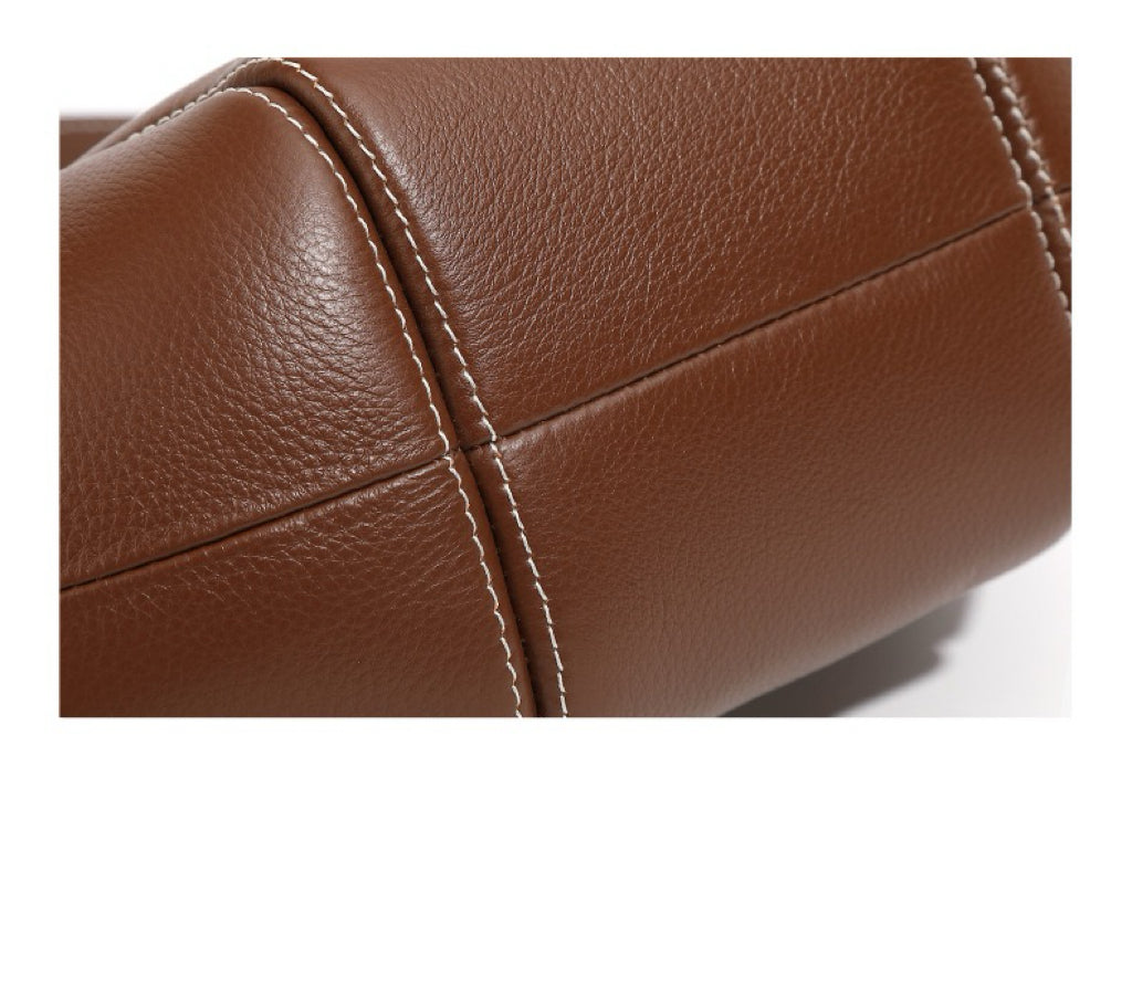 Comfortable and Chic Handbag with Rolled Top Handles and Adjustable Strap