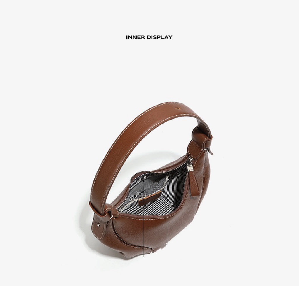 Comfortable and Chic Handbag with Rolled Top Handles and Adjustable Strap